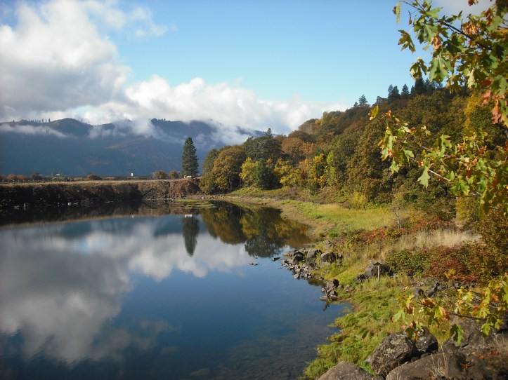 Clouds are mirrored in the blue waters near Coyote Wall in Washington state. Photo by Tim Graves